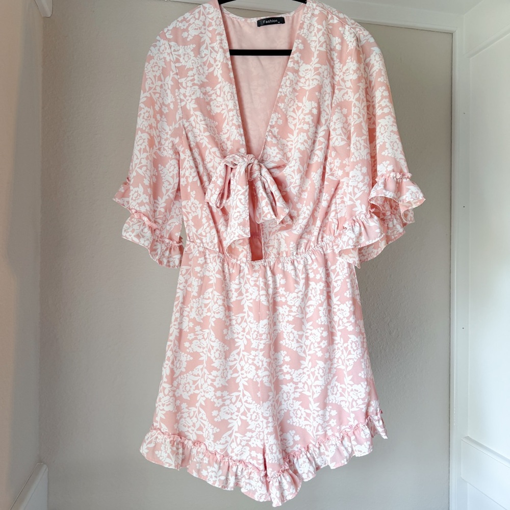 Pink tie front floral ruffle romper